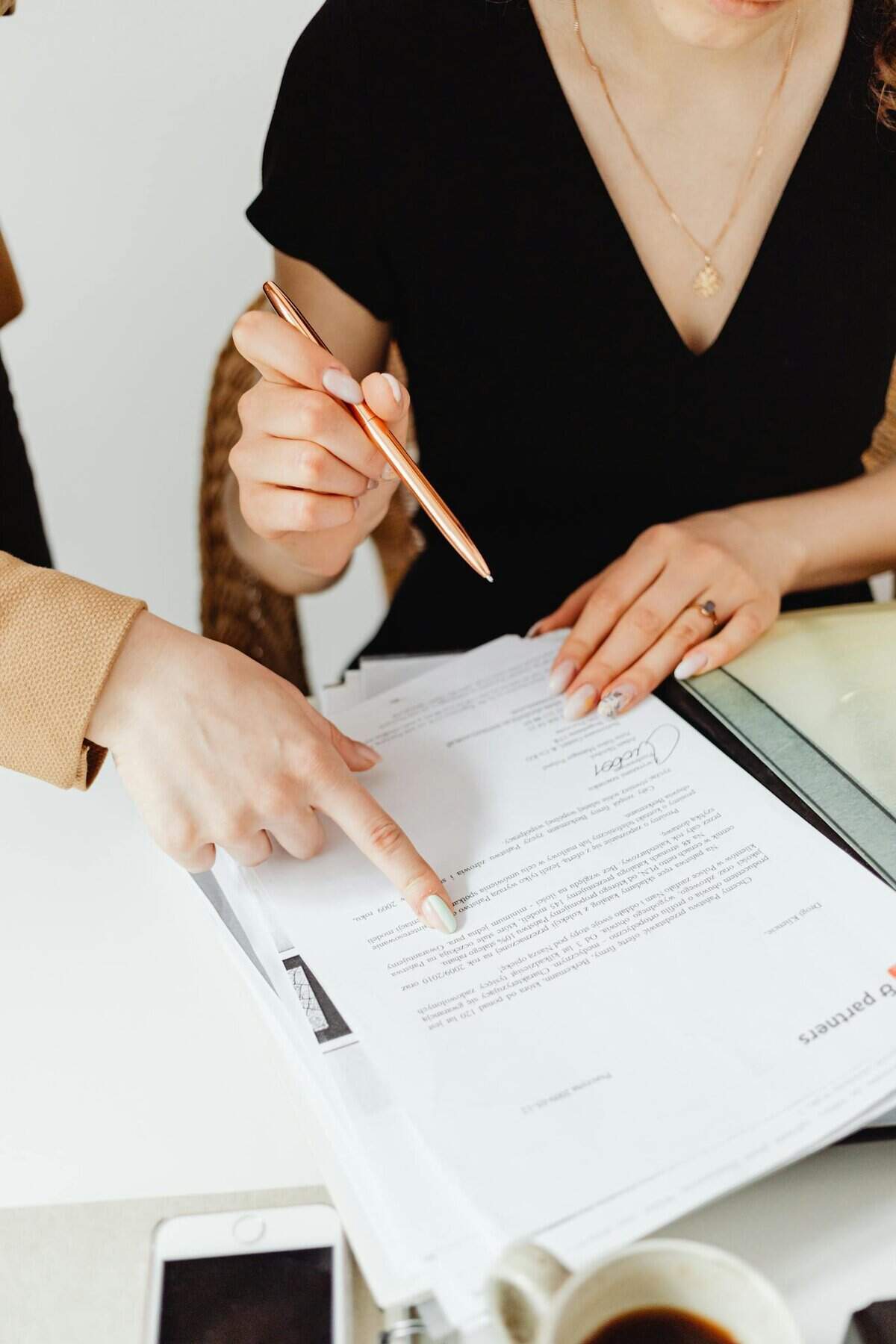 two business professionals reviewing documents together